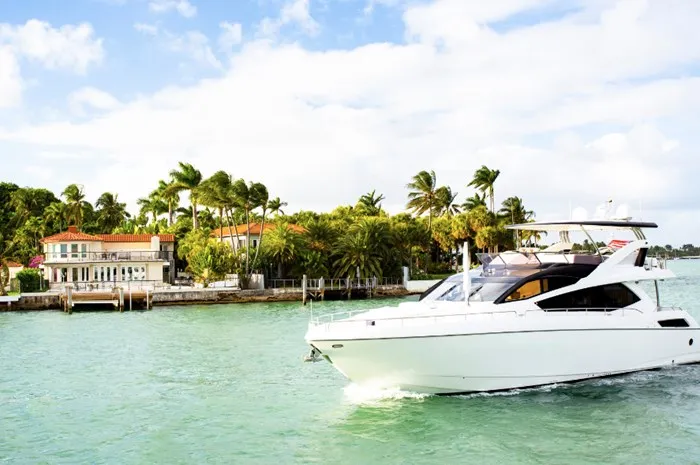 Miami Mansion with Passing Yacht